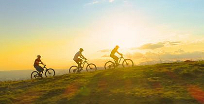 Tourists riding different types of bicycles
