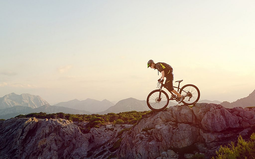 Mountain biker on a steep terrain
