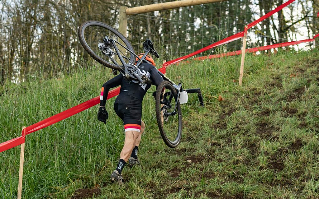 Cyclocross bike racer competes in a cyclocross bike race