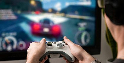 Man playing one of the 2022 racing video games