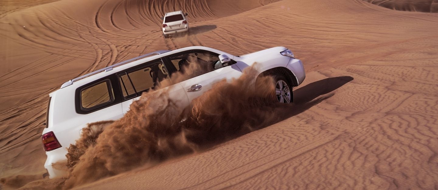 SUVs driving in the desert