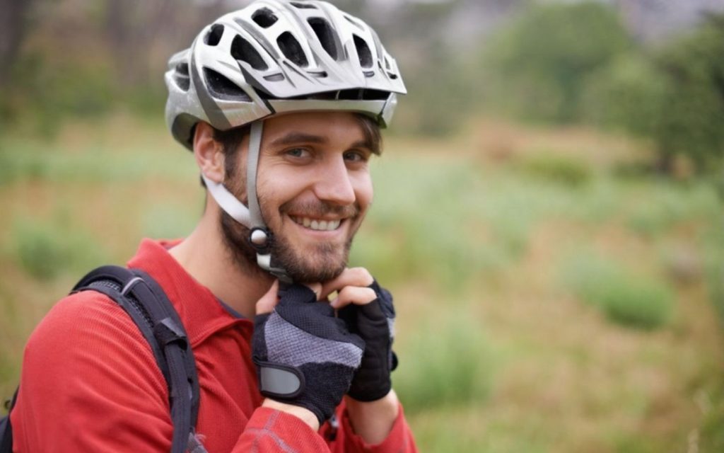 A cyclist wearing helmet for safety