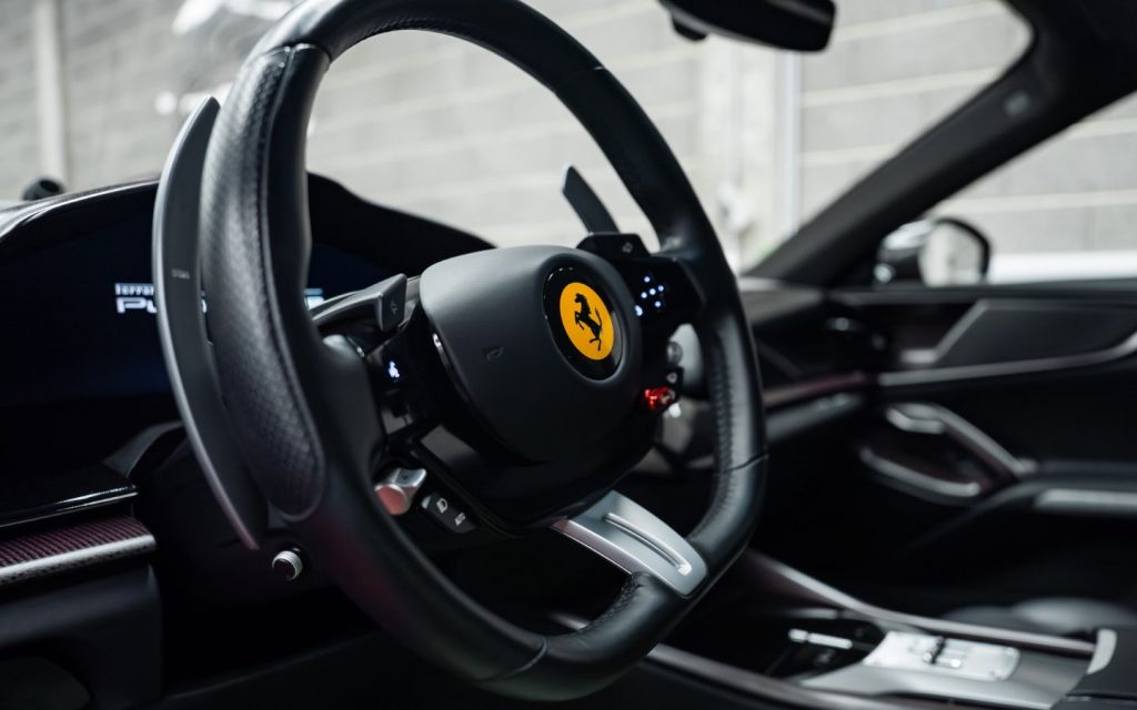 Close-up of a Ferrari car steering wheel