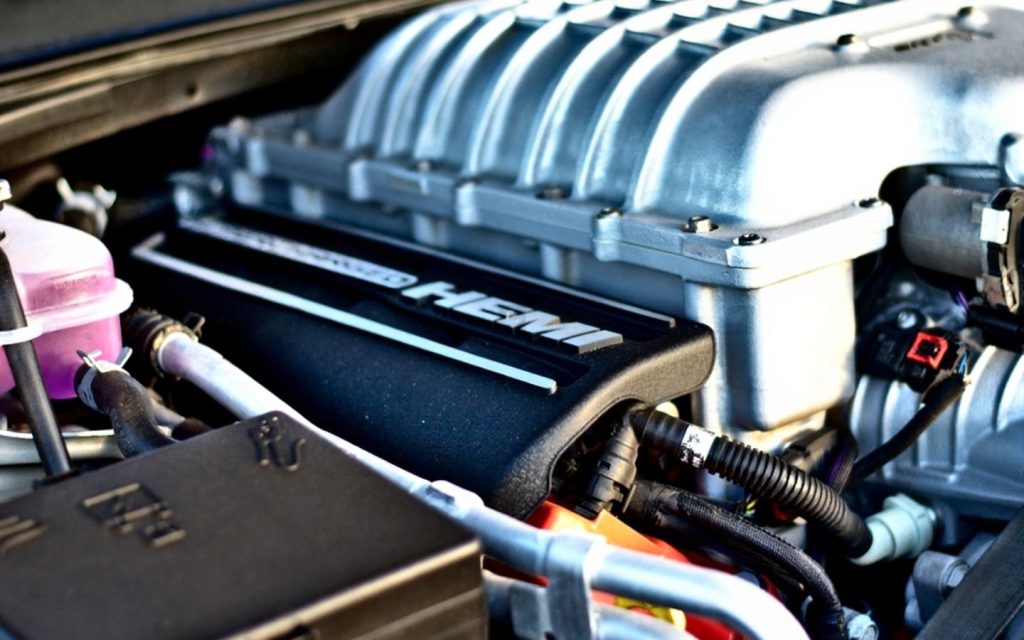 A hemi engine is a hemispherical engine with rounded top pistons