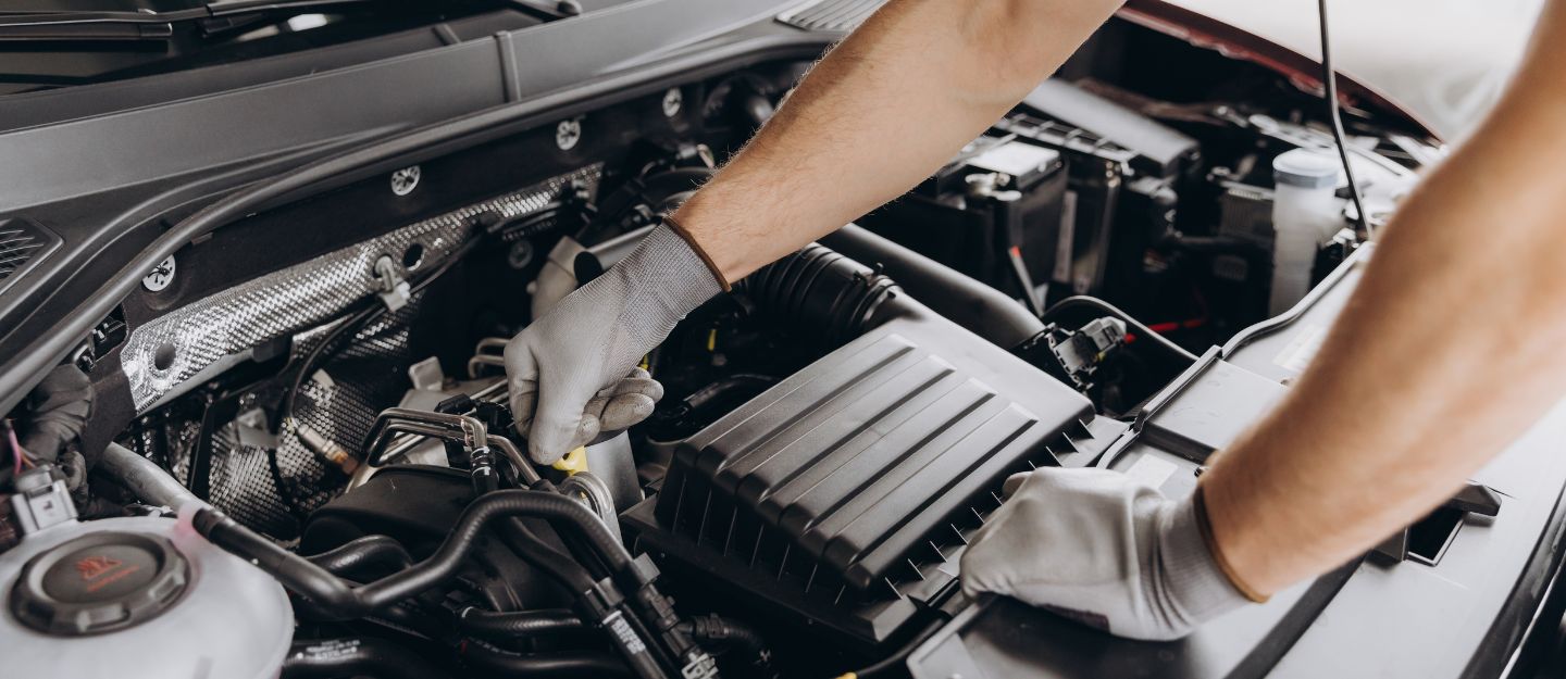Mechanic checking the car engine