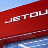 Jetour dealership exterior with logo and signage.