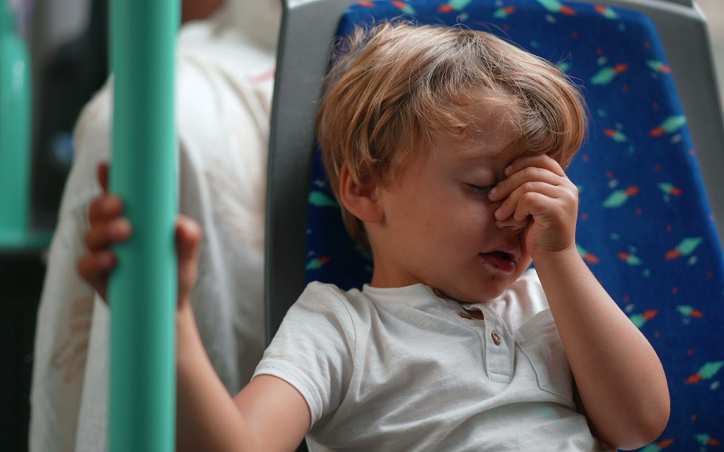 A child travelling in a bus