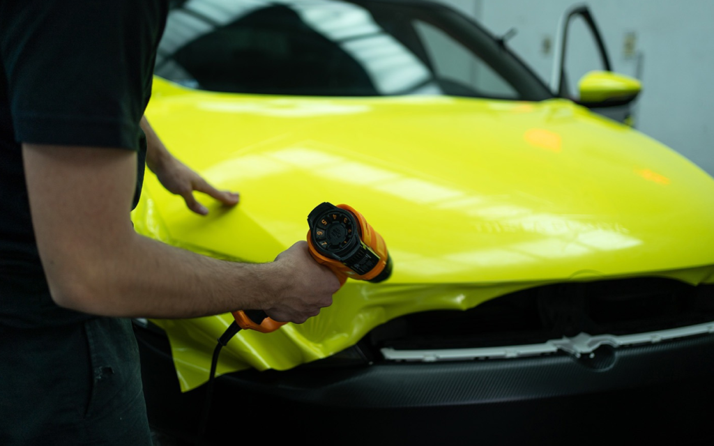 heating the vinyl wrapper for proper coerage of car