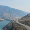 car driving between mountains