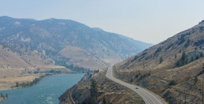 car driving between mountains