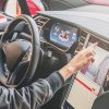 woman driving tesla