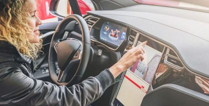 woman driving tesla