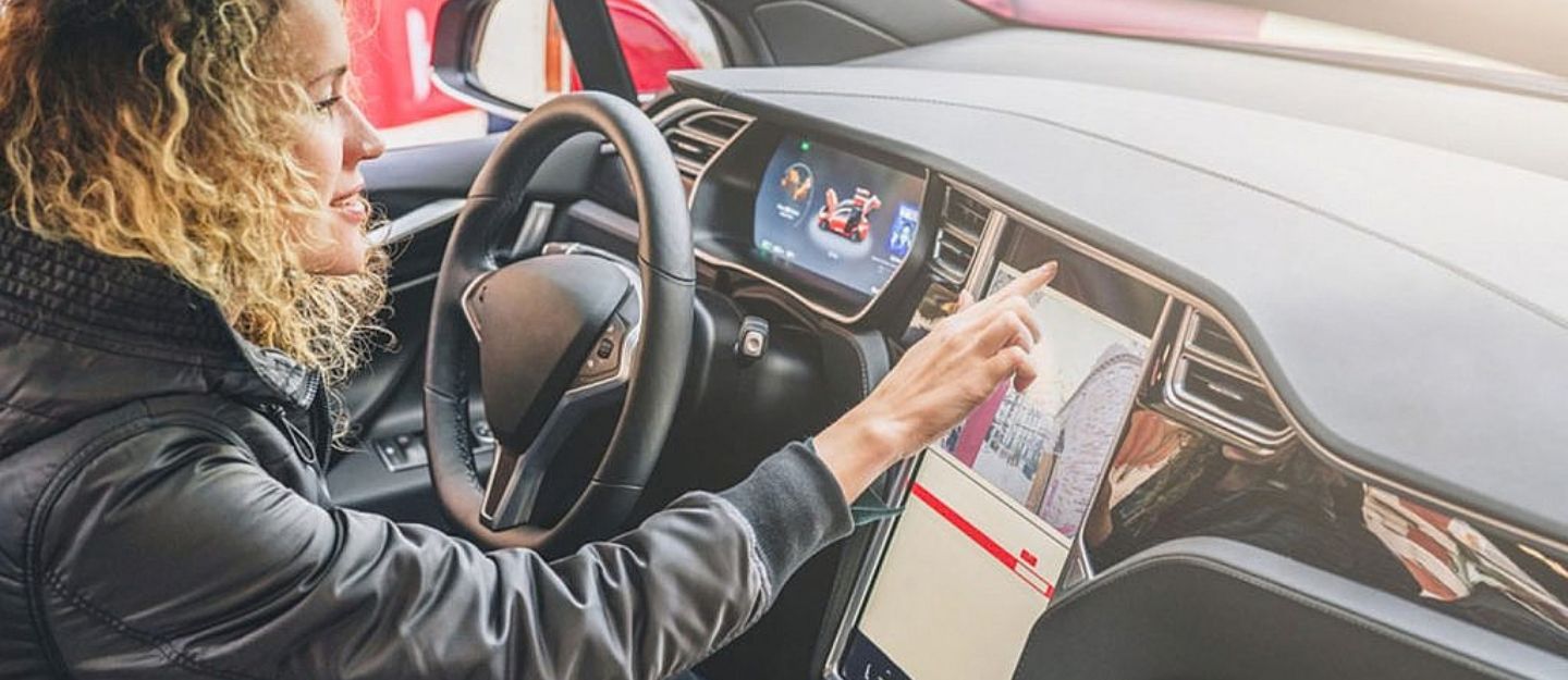 woman driving tesla