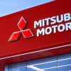 Mitsubishi Motors dealership exterior with logo and signage.