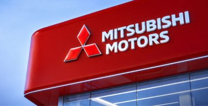 Mitsubishi Motors dealership exterior with logo and signage.