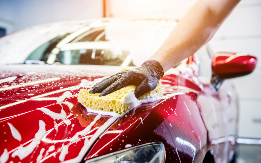 washing the car with a sponge 