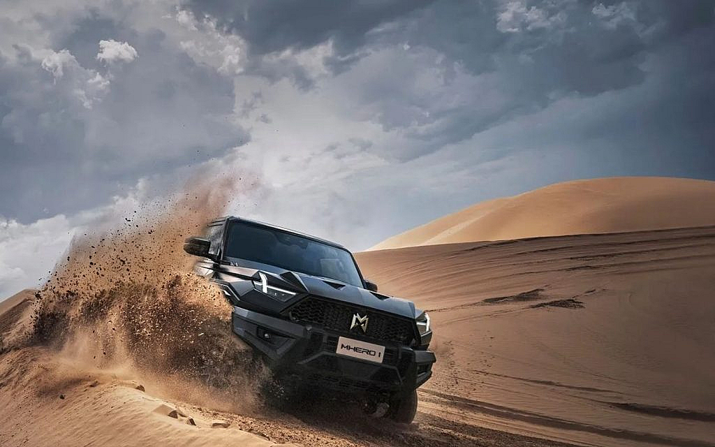 Extreme off-roading SUV in a sand dune