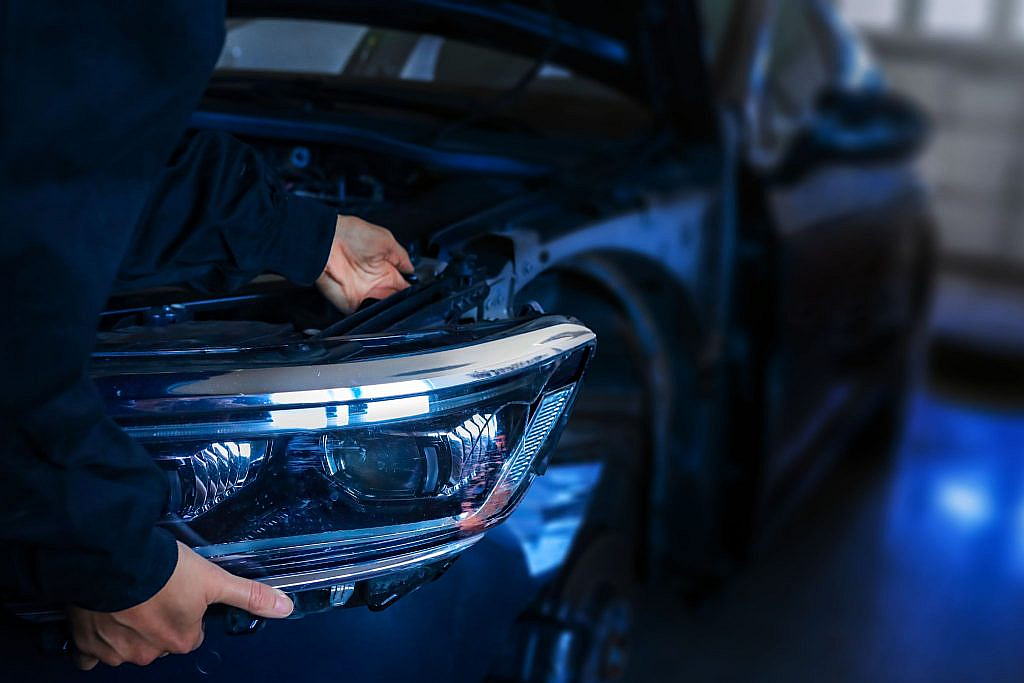  a person checking ev brakes in car