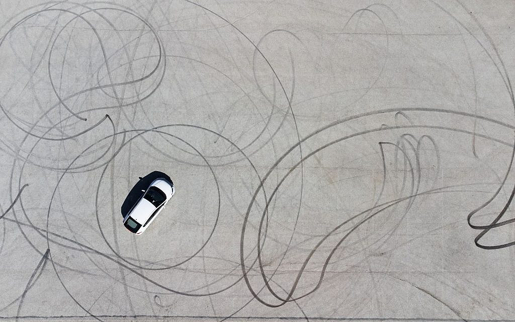 Oversteer happens when the rear tyres lose grip, causing the car to slide outward.