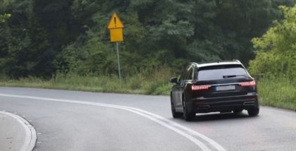 car on road in the woods
