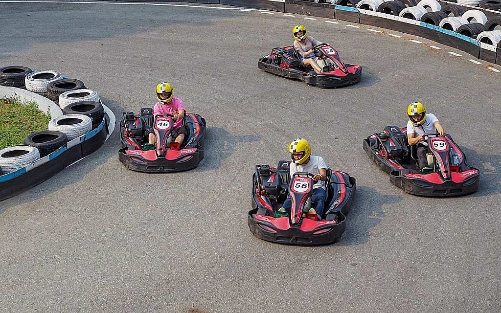 drivers go-karting as a practice session