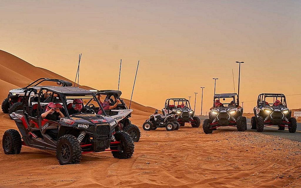 dune buggies standing in a desert