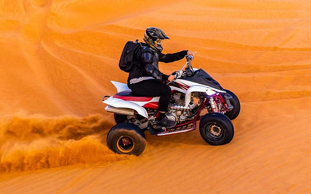 A rider riding an ATV