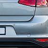 Silver Volkswagen Golf rear view with parking sensors.