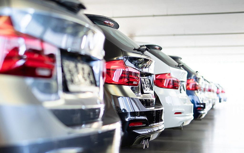Row of cars showing bumpers.