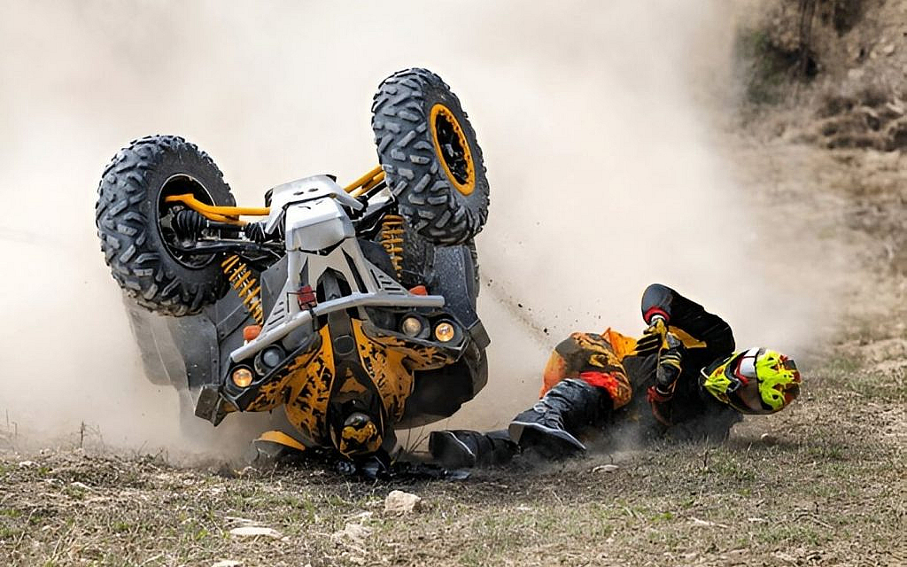 A rider falling from an ATV