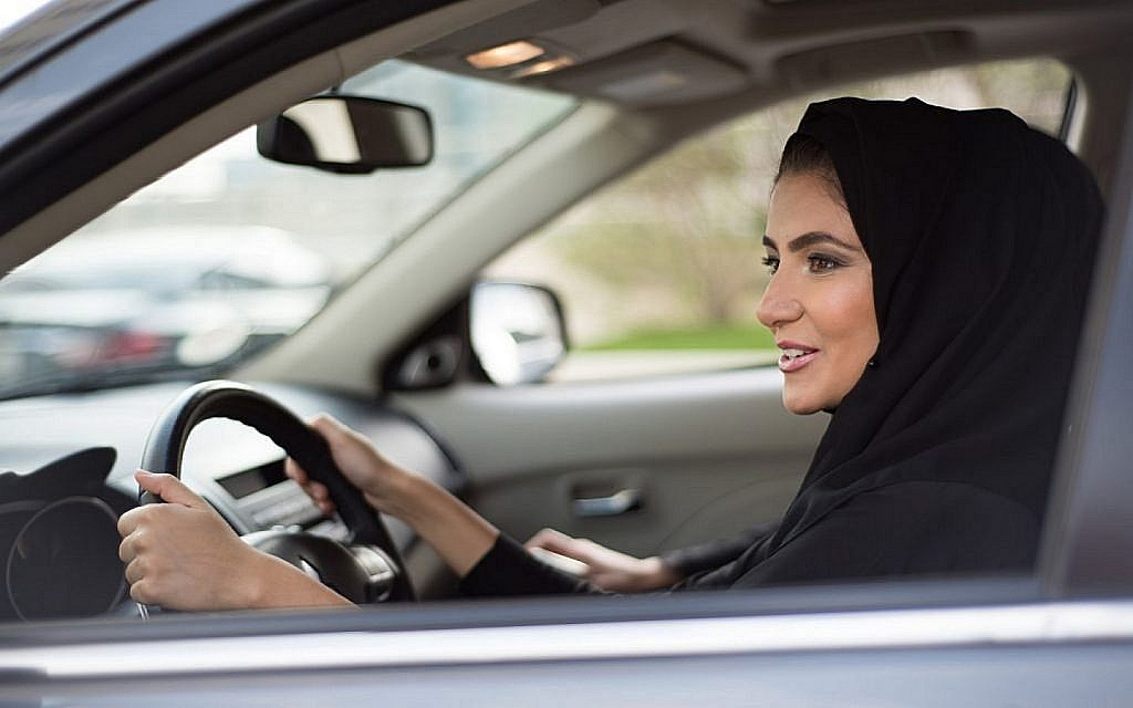 A happy woman driving in UAE