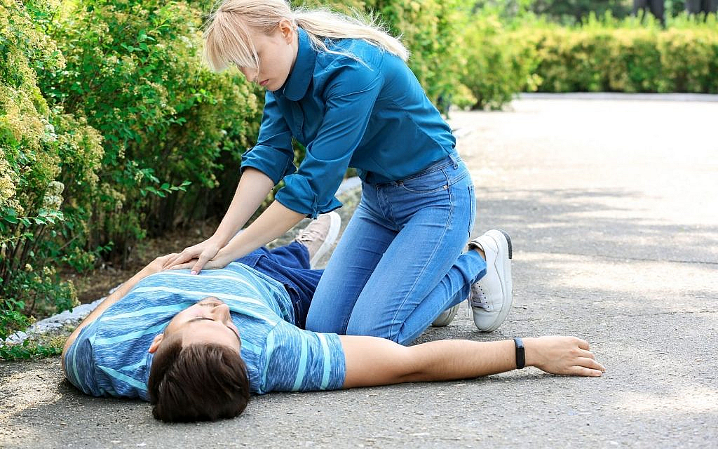 A woman giving CPR