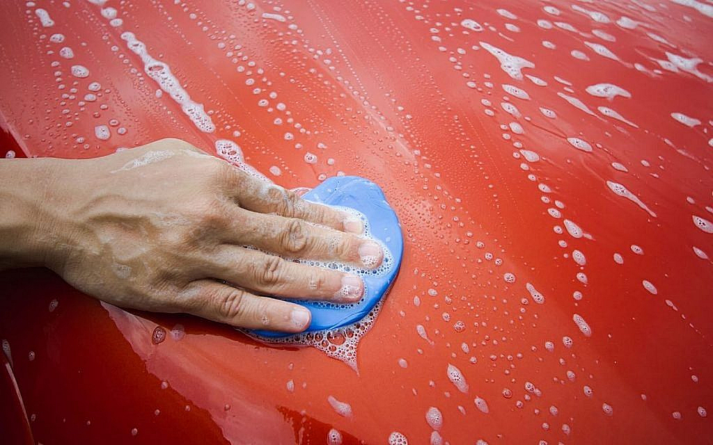 Using a clay bar on a car