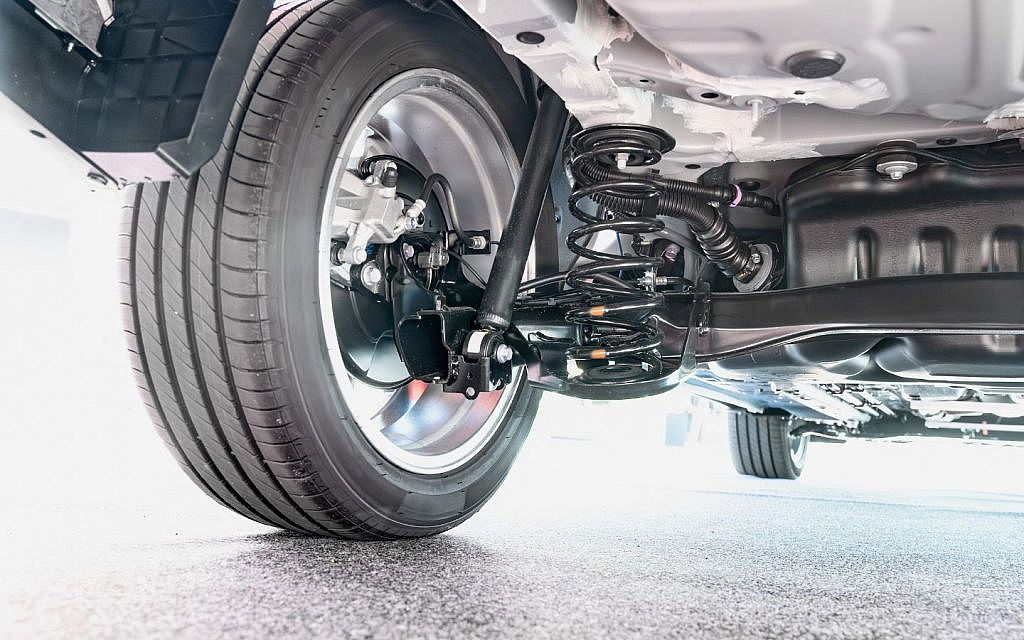 A close-up view of a car's rear suspension system.