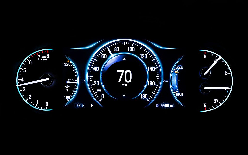 Modern digital car dashboard displaying mileage.