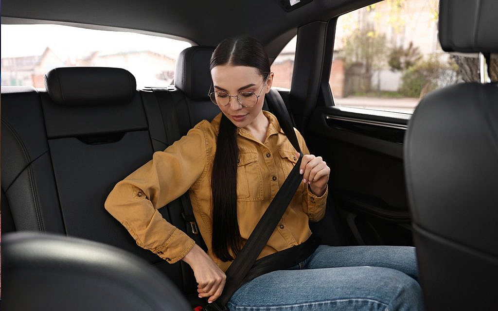 A seatbelt reduces injury risk, but a stuck one poses a safety hazard.