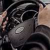 Car interior showing steering wheel misalignment – off-center steering wheel causes and fixes.