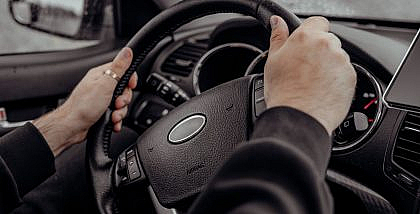 Car interior showing steering wheel misalignment – off-center steering wheel causes and fixes.