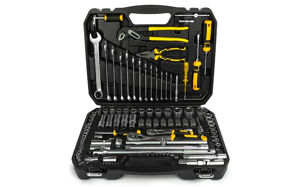 Toolbox with essential tools for car repairs during a rainy road trip.