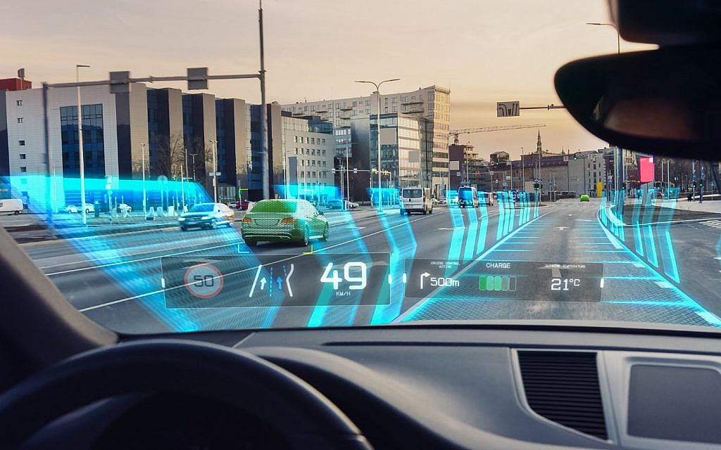 Futuristic self-driving car cruising through a digital city with glowing road paths