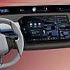 Interior view of a BMW featuring the wide BMW Panoramic iDrive screen displaying navigation, media, and vehicle information.