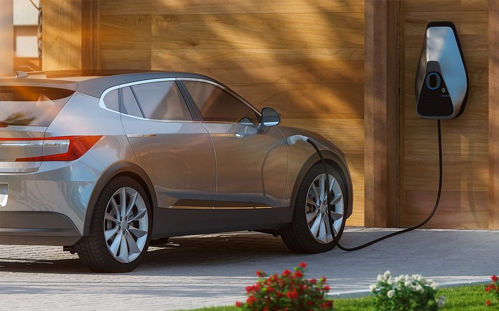 Gray EV getting charged at home
