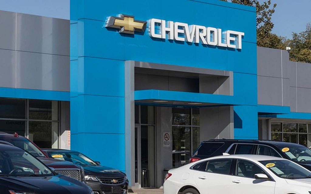 Al Ghandi Auto dealership in UAE with Chevrolet, GMC, and Cadillac models