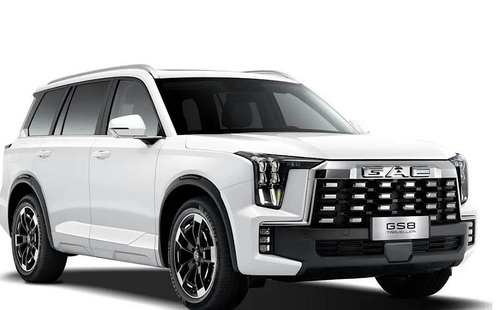 White GAC GS8 Traveller SUV with a bold grille and distinctive vertical lights, against a white background.