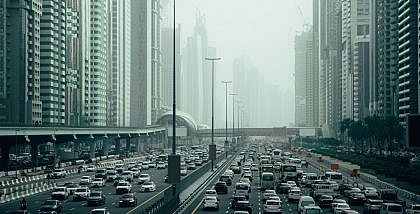 Dubai city street filled with heavy traffic, illustrating the Dubai traffic surge.