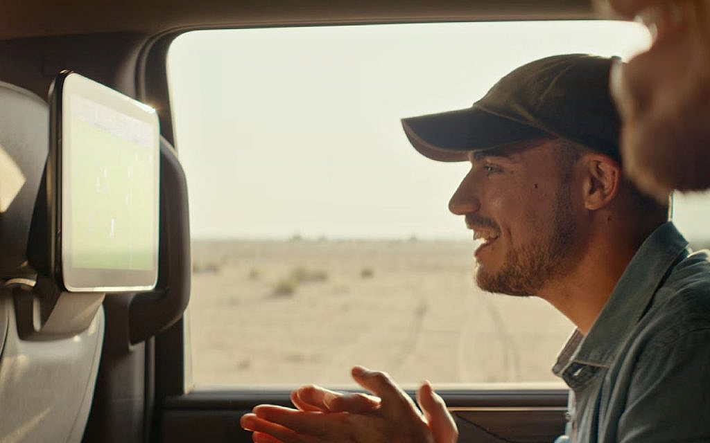 A passenger enjoying in the car