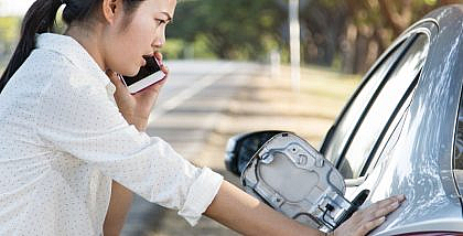 women trying to open stuck fuel cap