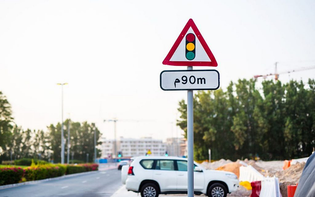 A road sign showing signal is 90 m away