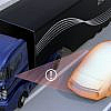 Blue truck and orange car in a near-collision, representing a Side Collision Warning System.