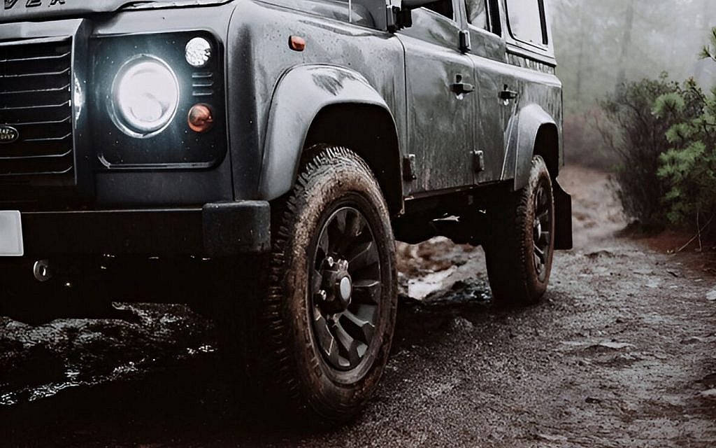 A car with intelligent 4x4 crossing rough terrain